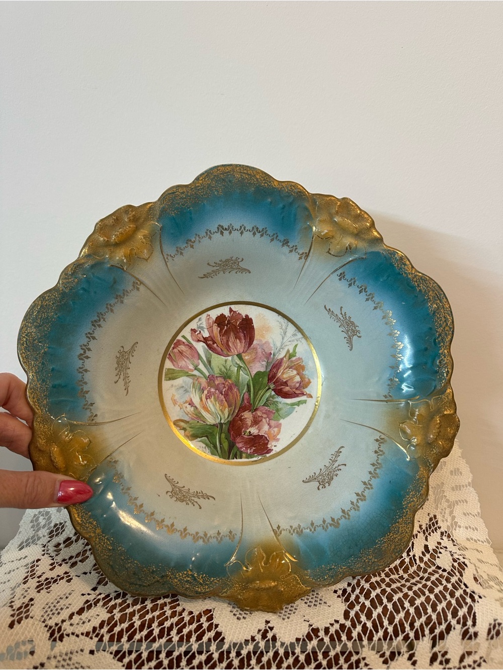 antique Victorian-era porcelain bowl featuring a teal-blue border and gold gilt
